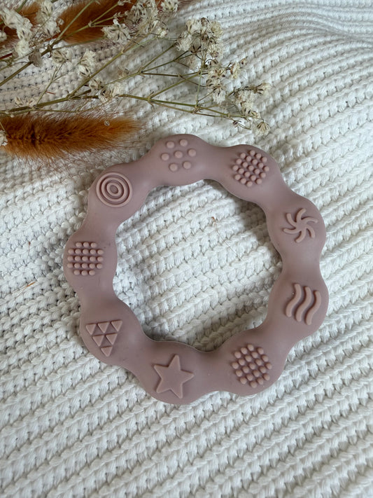 Jouet en silicone rond rose poudré